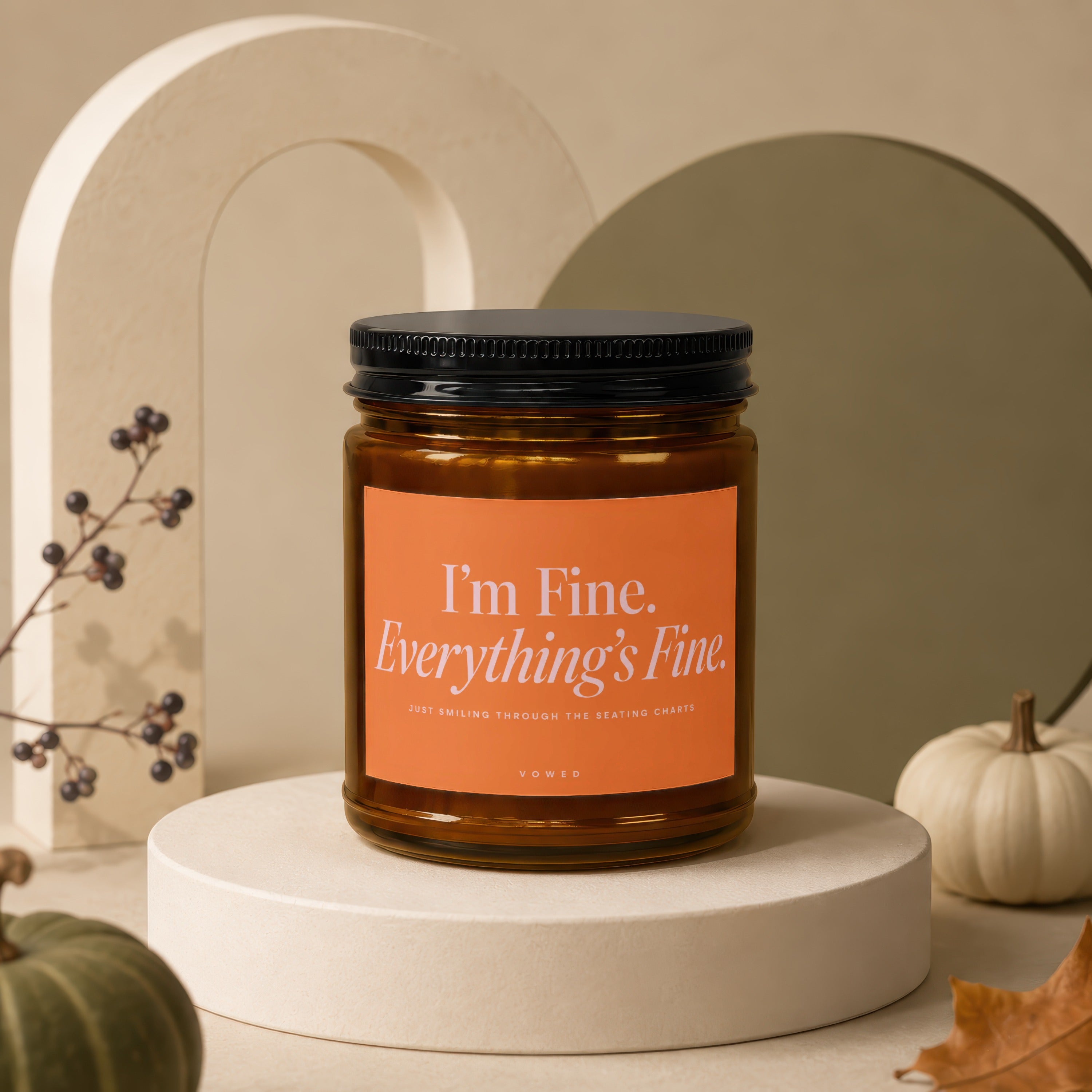 Amber candle with "I'm Fine. Everything's Fine." text on orange label.