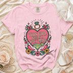 Pink t-shirt with graphic "This Girl Needs A Spicy Marg", margarita, and peppers.