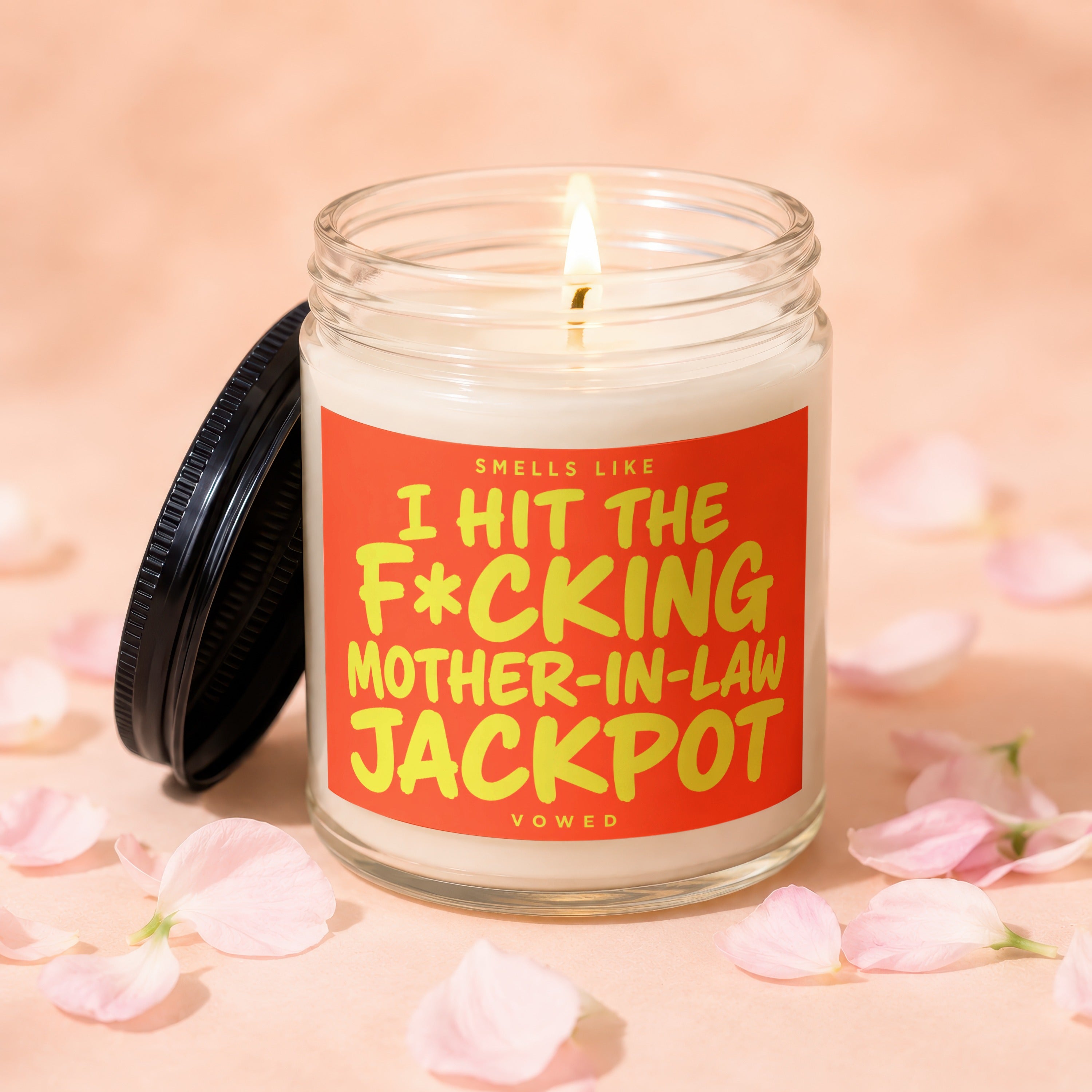 Candle with text "Smells like I hit the F*cking Mother-in-Law Jackpot".