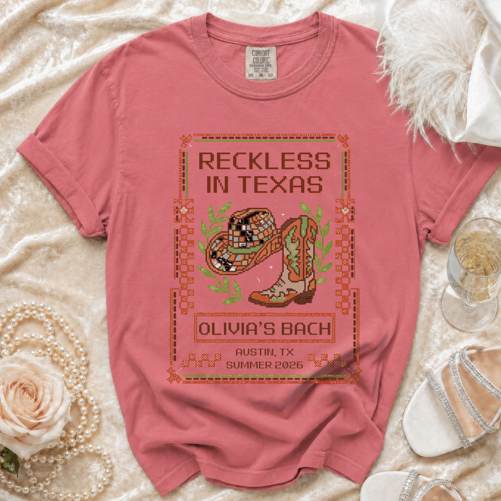 Pink t-shirt with "Reckless in Texas" and "Olivia's Bach Austin, TX Summer 2026" text.