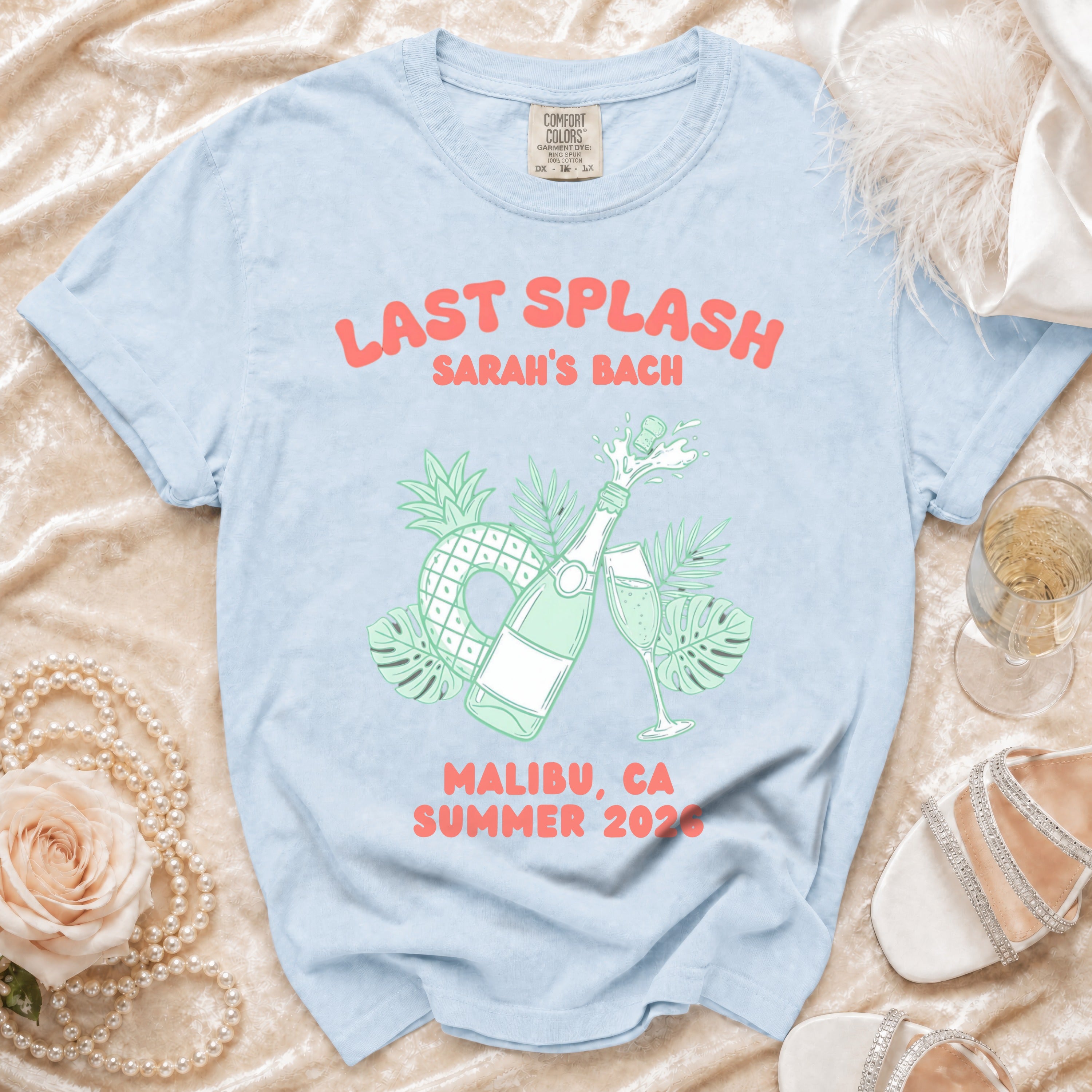 Light blue t-shirt with "Last Splash Sarah's Bach Malibu, CA Summer 2026" text.