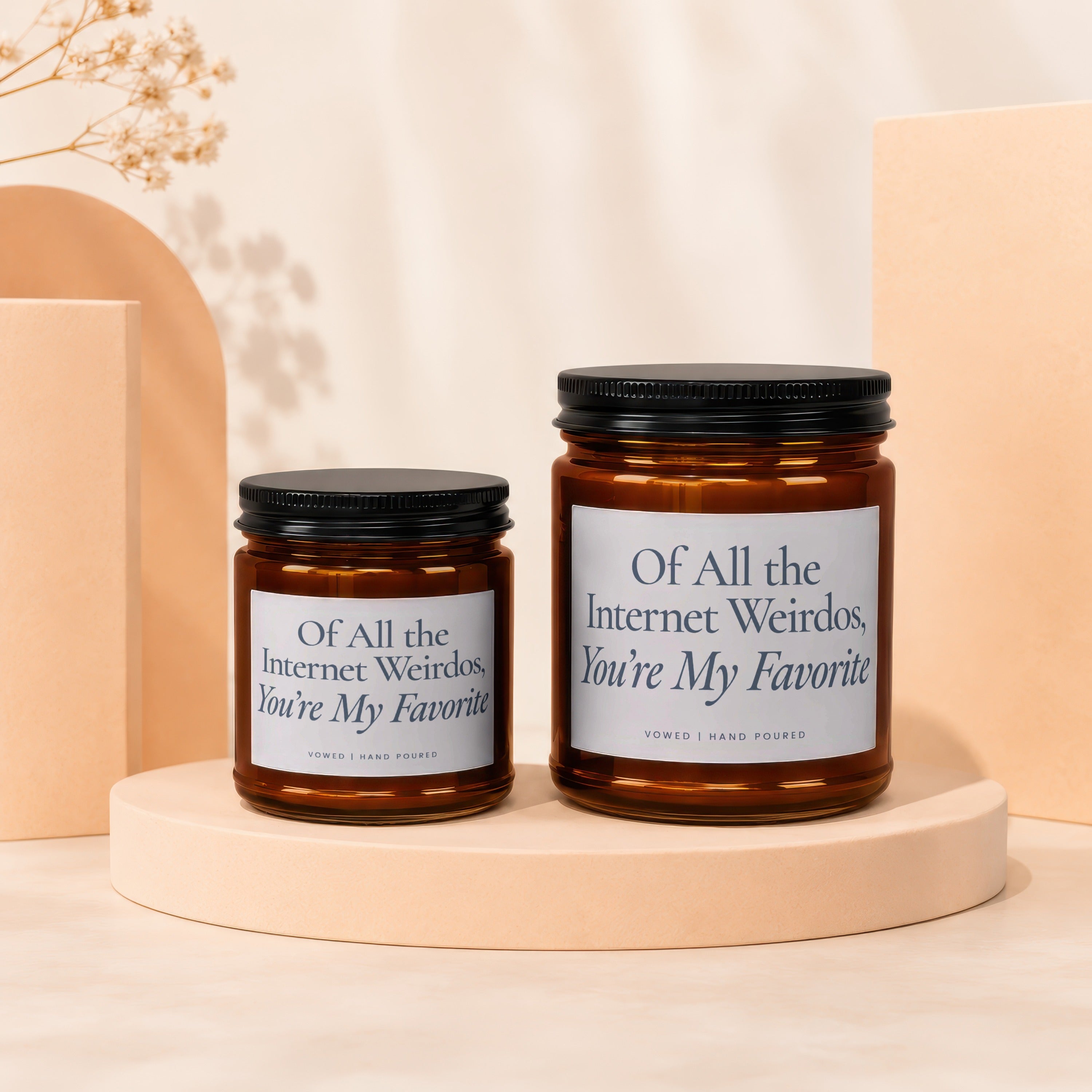 Two amber glass candles with black lids, each saying "Of All the Internet Weirdos, You're My Favorite."