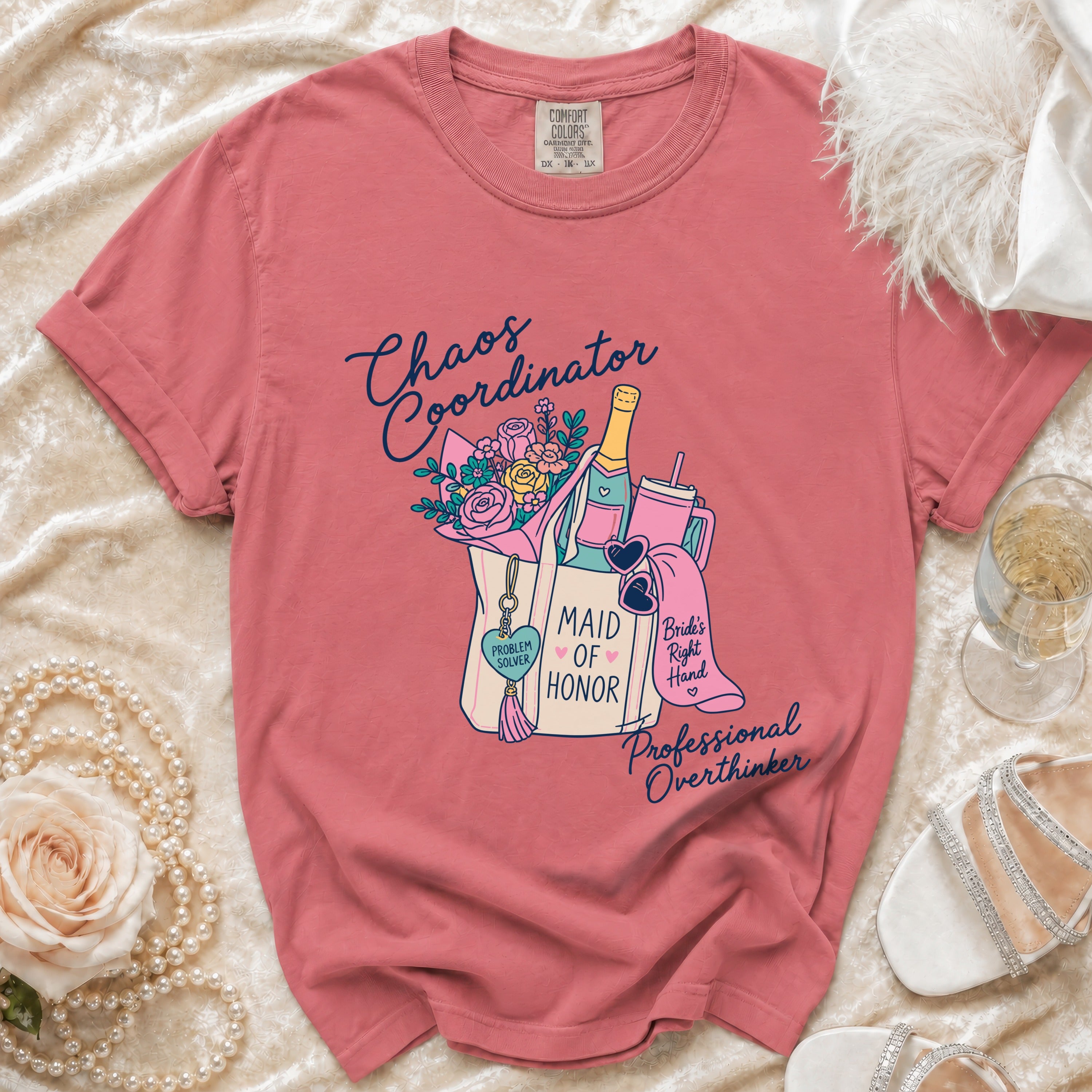 Pink t-shirt with "Chaos Coordinator," "Maid of Honor," and "Professional Overthinker" graphic.