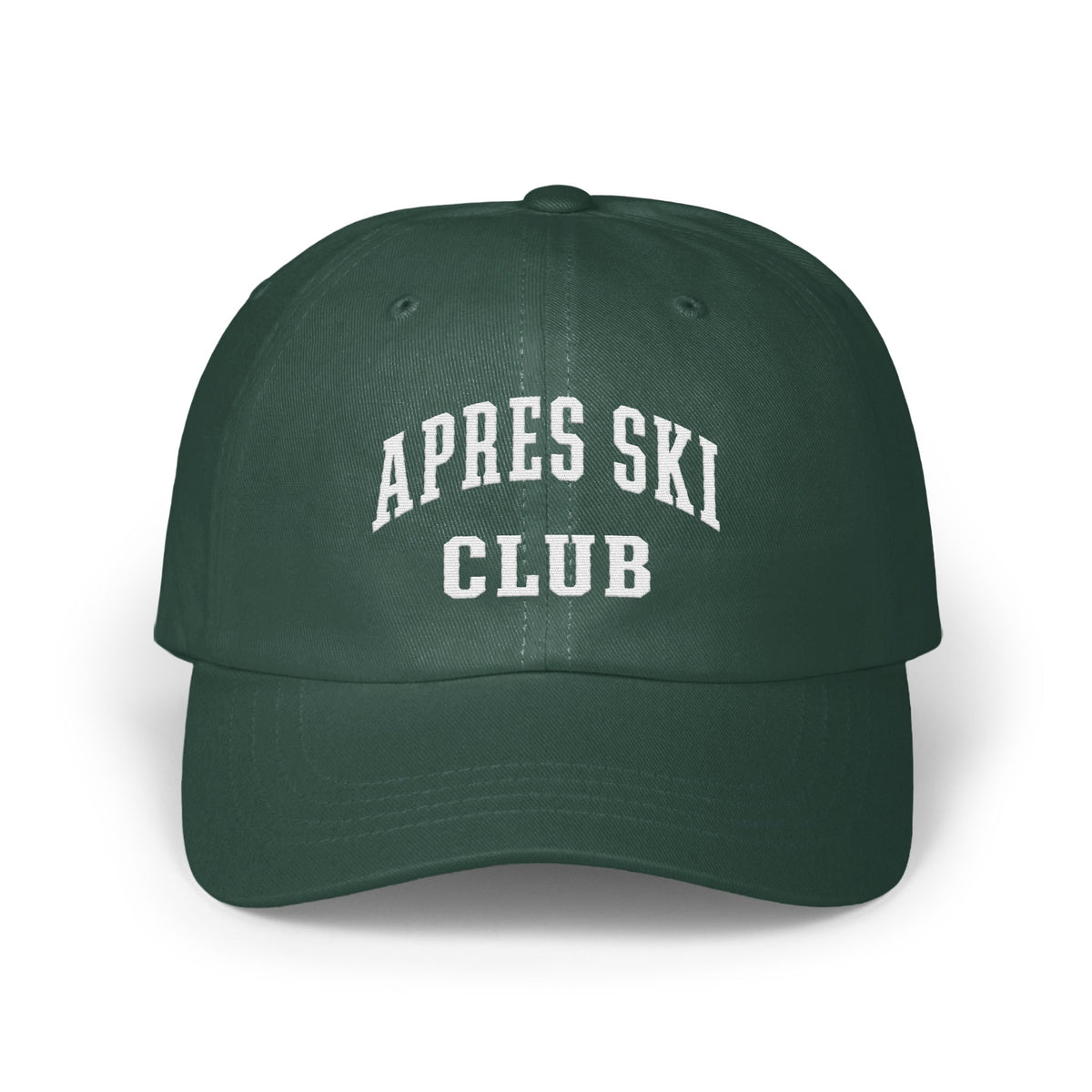 A dark green baseball cap featuring the white embroidered text APRES SKI CLUB across the front.