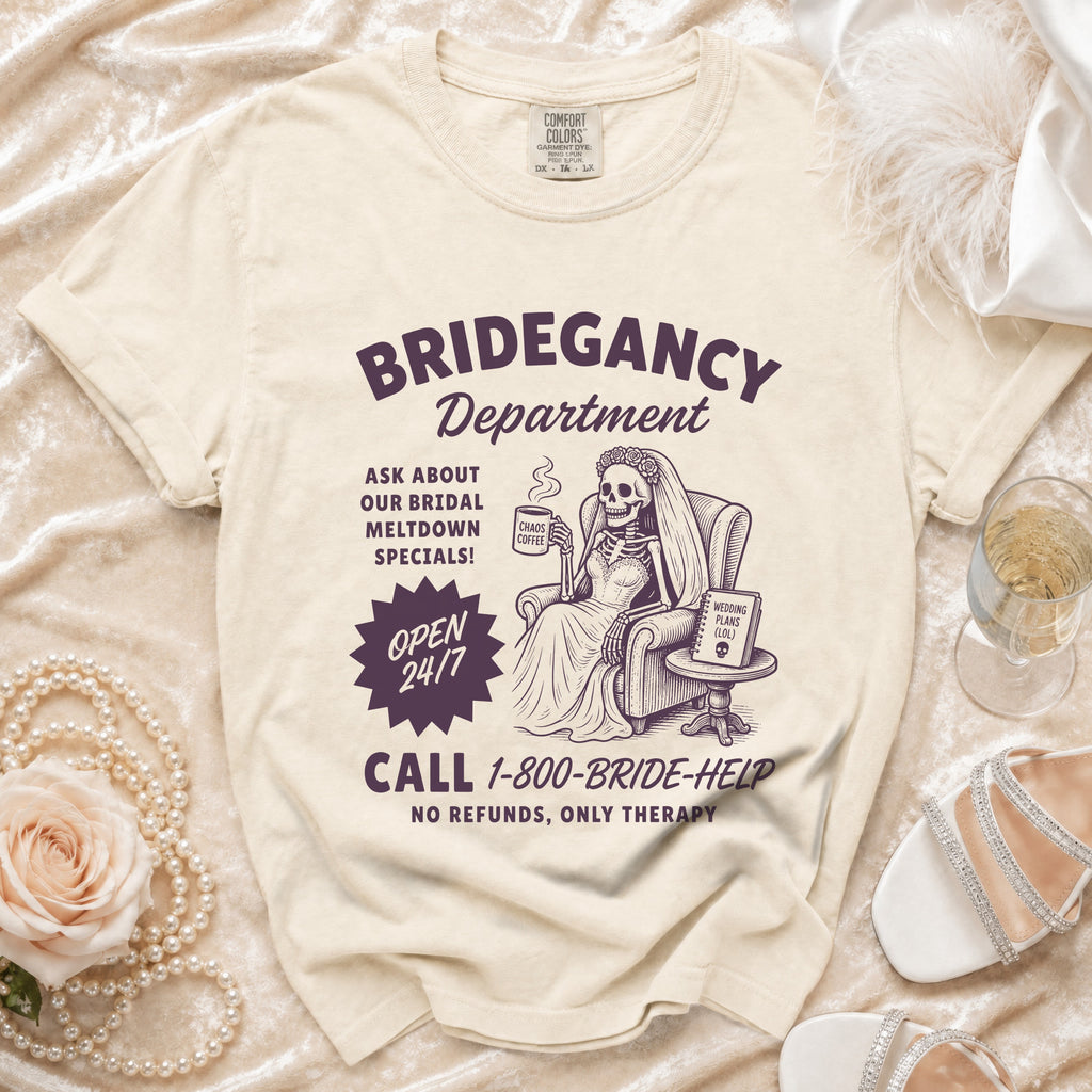 T-shirt graphic with skeleton bride, text "Bridegancy Department", and "1-800-BRIDE-HELP".