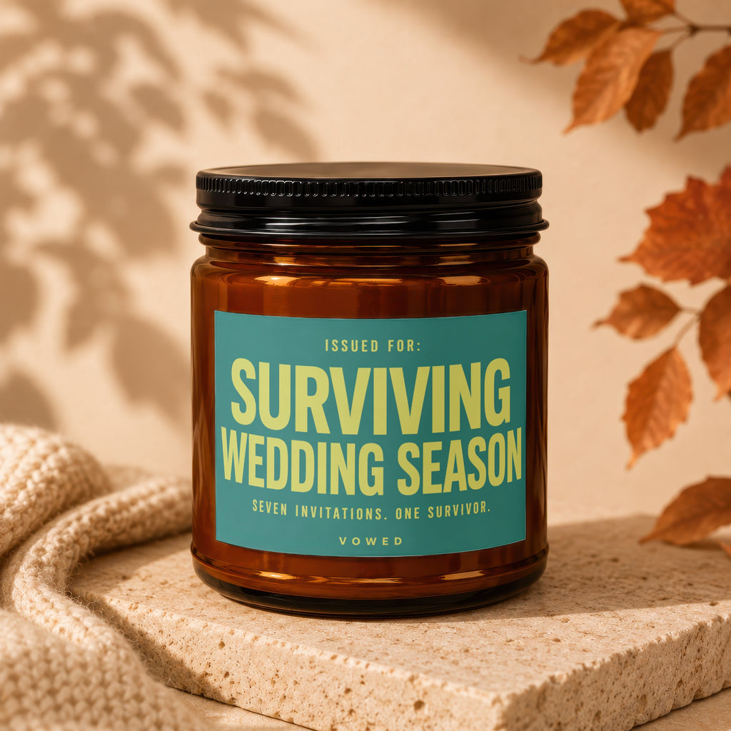 Brown candle with teal label reading "Surviving Wedding Season".