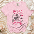 Pink t-shirt with skeleton bride graphic and text "BRIDES don't die we ghost THE EX".