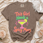 Brown t-shirt with "This Girl Needs a Spicy Marg" and margarita graphic.