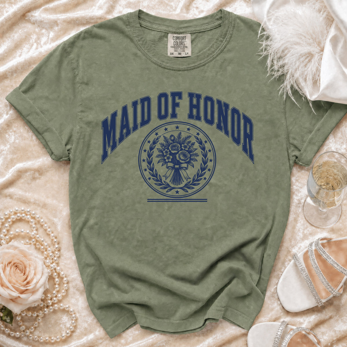 Olive green t-shirt with "Maid of Honor" text and floral bouquet graphic.