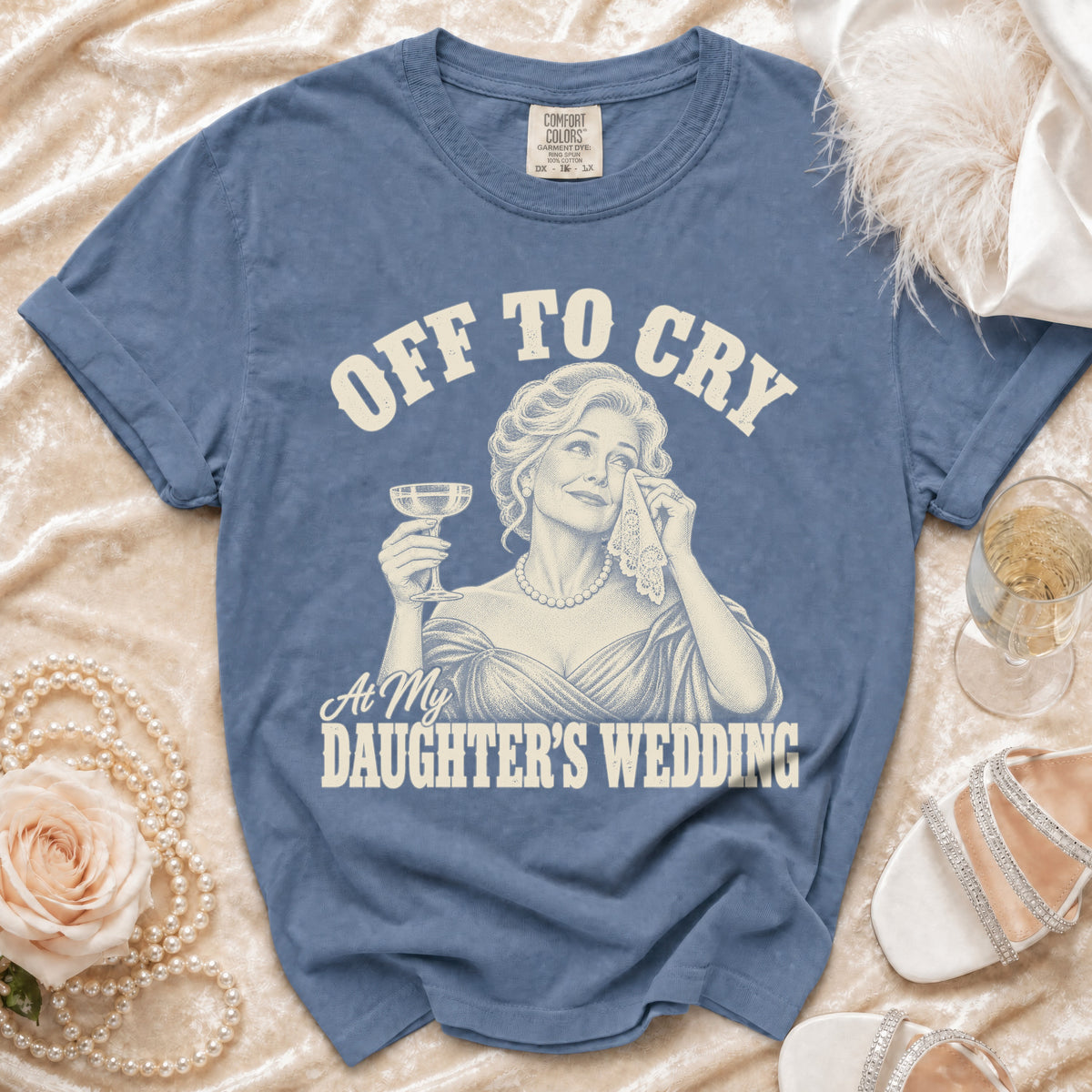 Blue t-shirt with "Off to Cry At My Daughter's Wedding" graphic.
