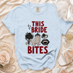 Light blue t-shirt with "This Bride Bites" text and gothic bridal graphics.