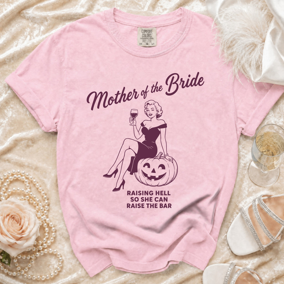 Pink shirt with "Mother of the Bride" and "Raising Hell So She Can Raise the Bar" text.