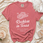 Comfort Colors t-shirt with "Reckless in Texas" and "Olivia's Bach" text.