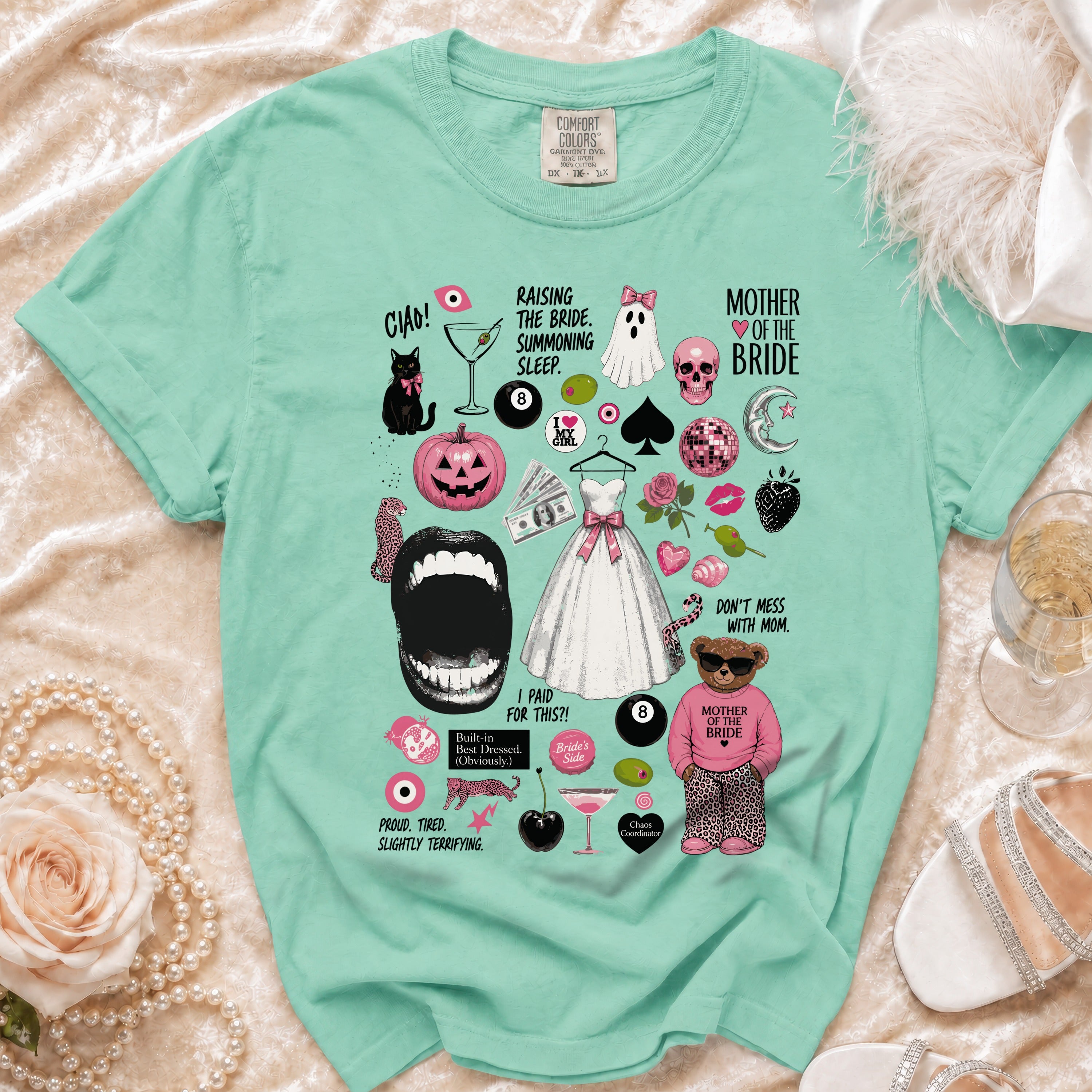 Mint green t-shirt with "Mother of the Bride" and humorous wedding illustrations.