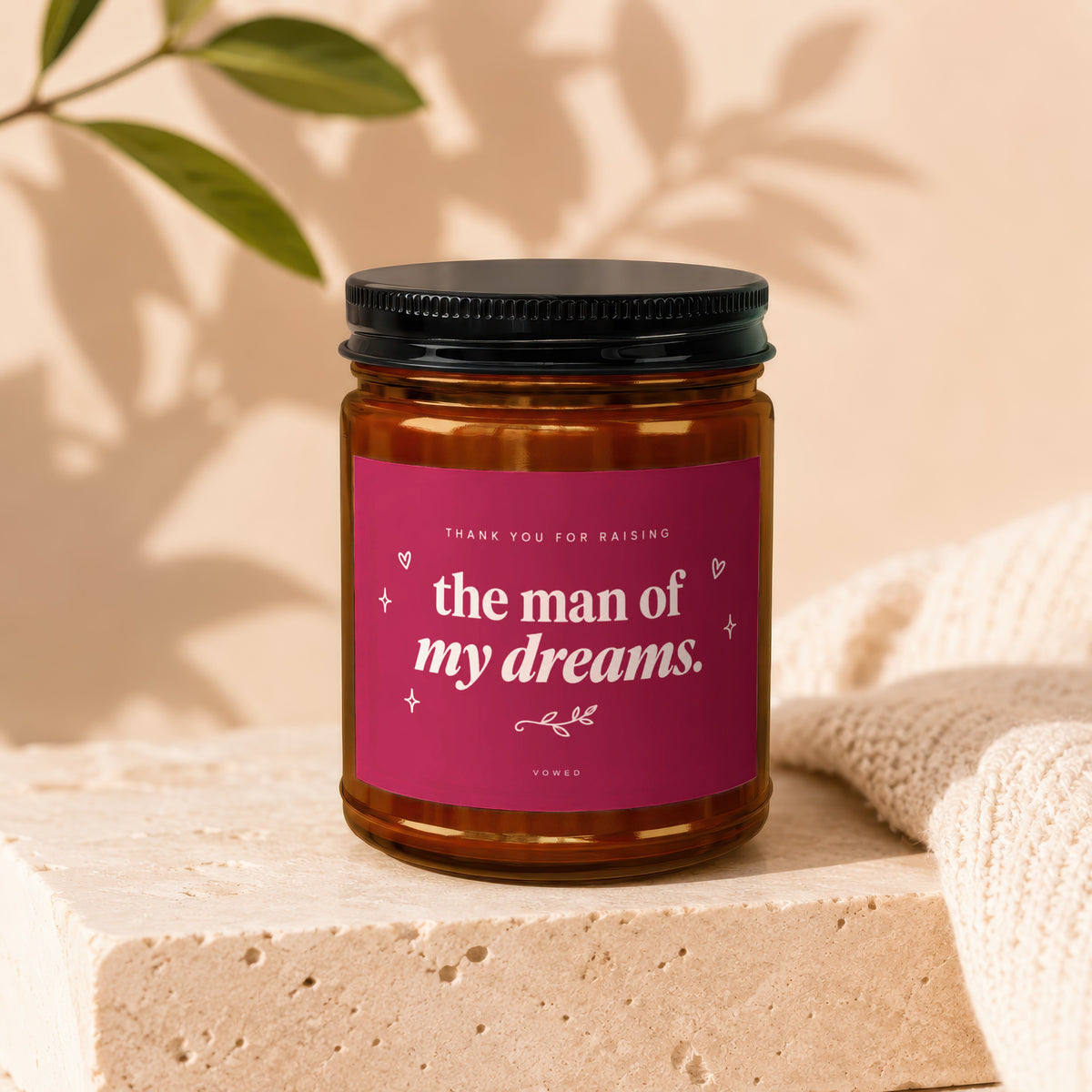 Amber glass candle with magenta label reading "Thank You For Raising the Man of My Dreams."