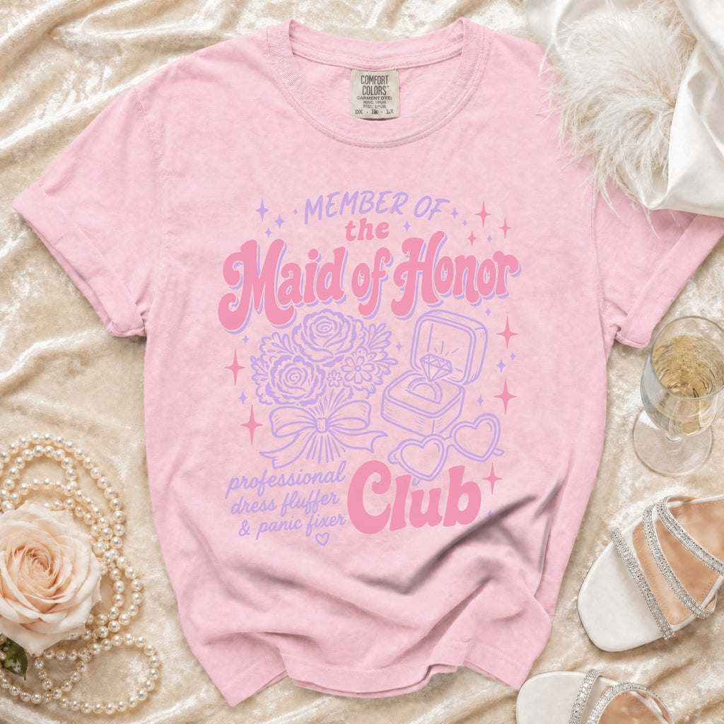 Pink t-shirt: "Member of the Maid of Honor Club, professional dress fluffer & panic fixer".