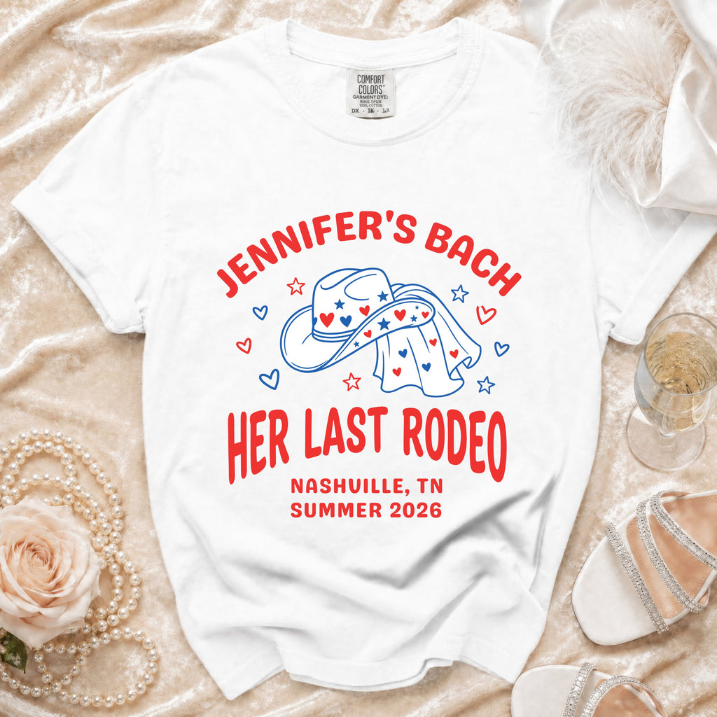 White t-shirt with "Jennifer's Bach Her Last Rodeo Nashville, TN Summer 2026" text and cowboy hat graphic.