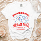 White t-shirt with "Jennifer's Bach Her Last Rodeo Nashville, TN Summer 2026" text and cowboy hat graphic.