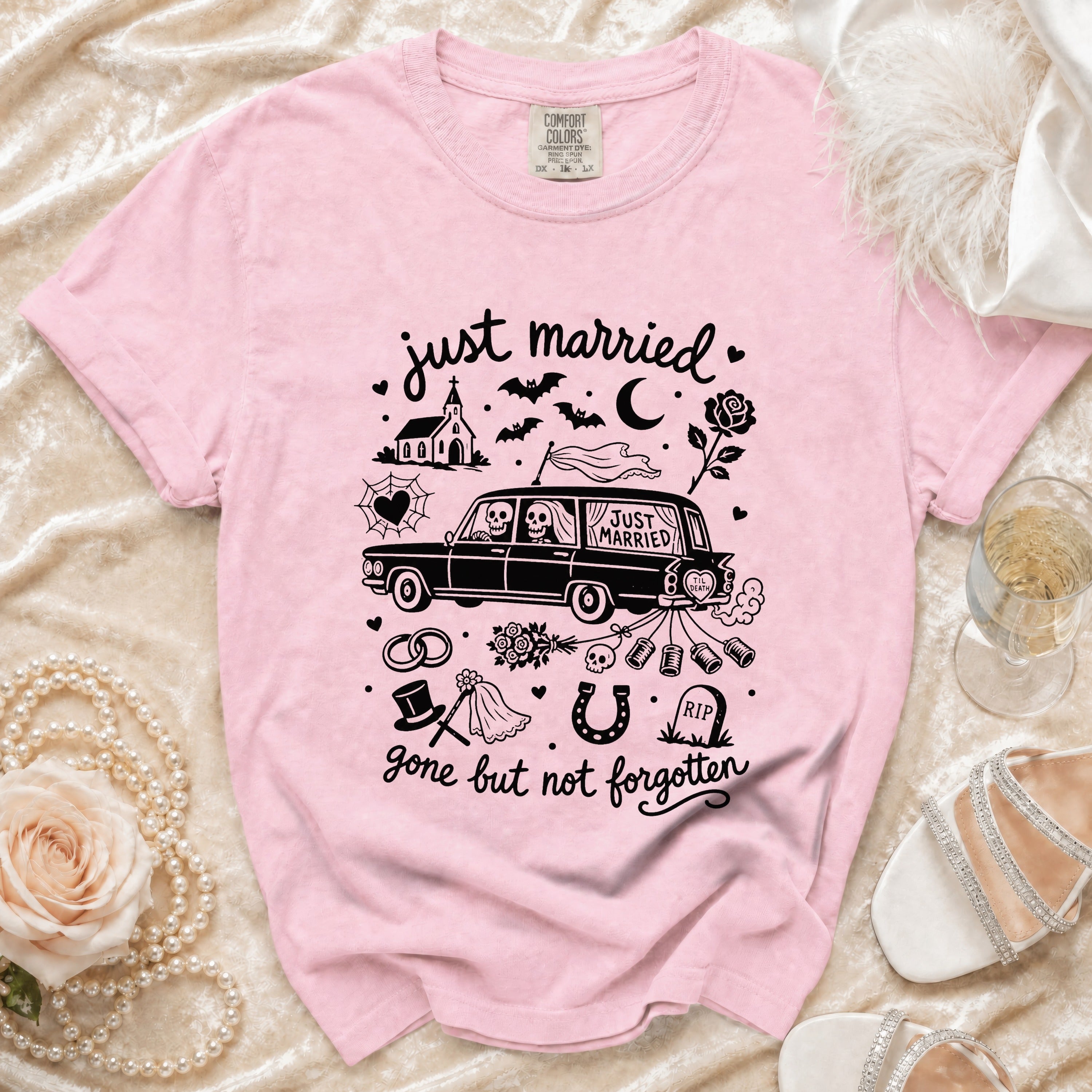 Pink t-shirt with "just married" and gothic wedding icons, including skeleton couple in hearse.