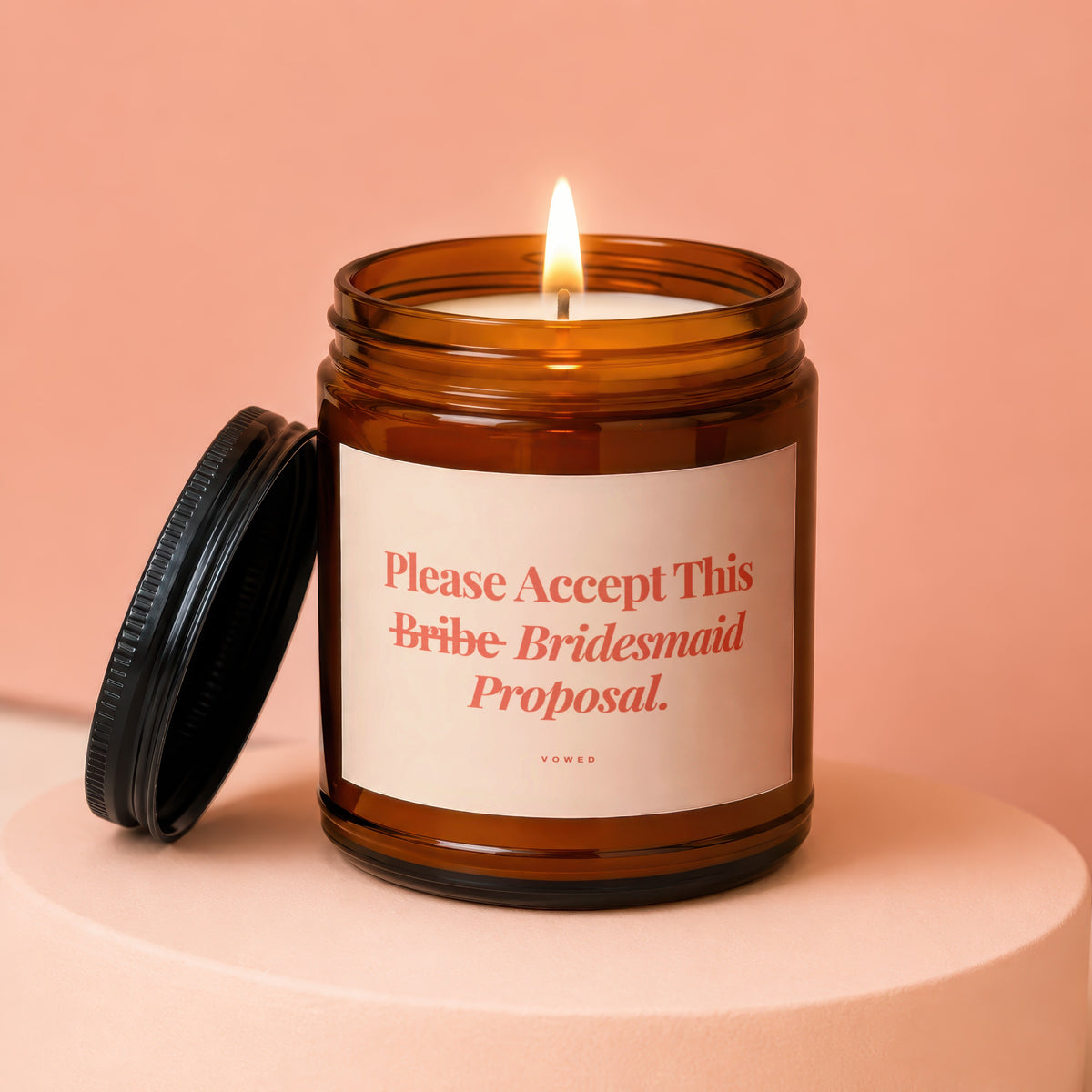 Amber jar candle with lit wick, "Please Accept This Bridesmaid Proposal" text.