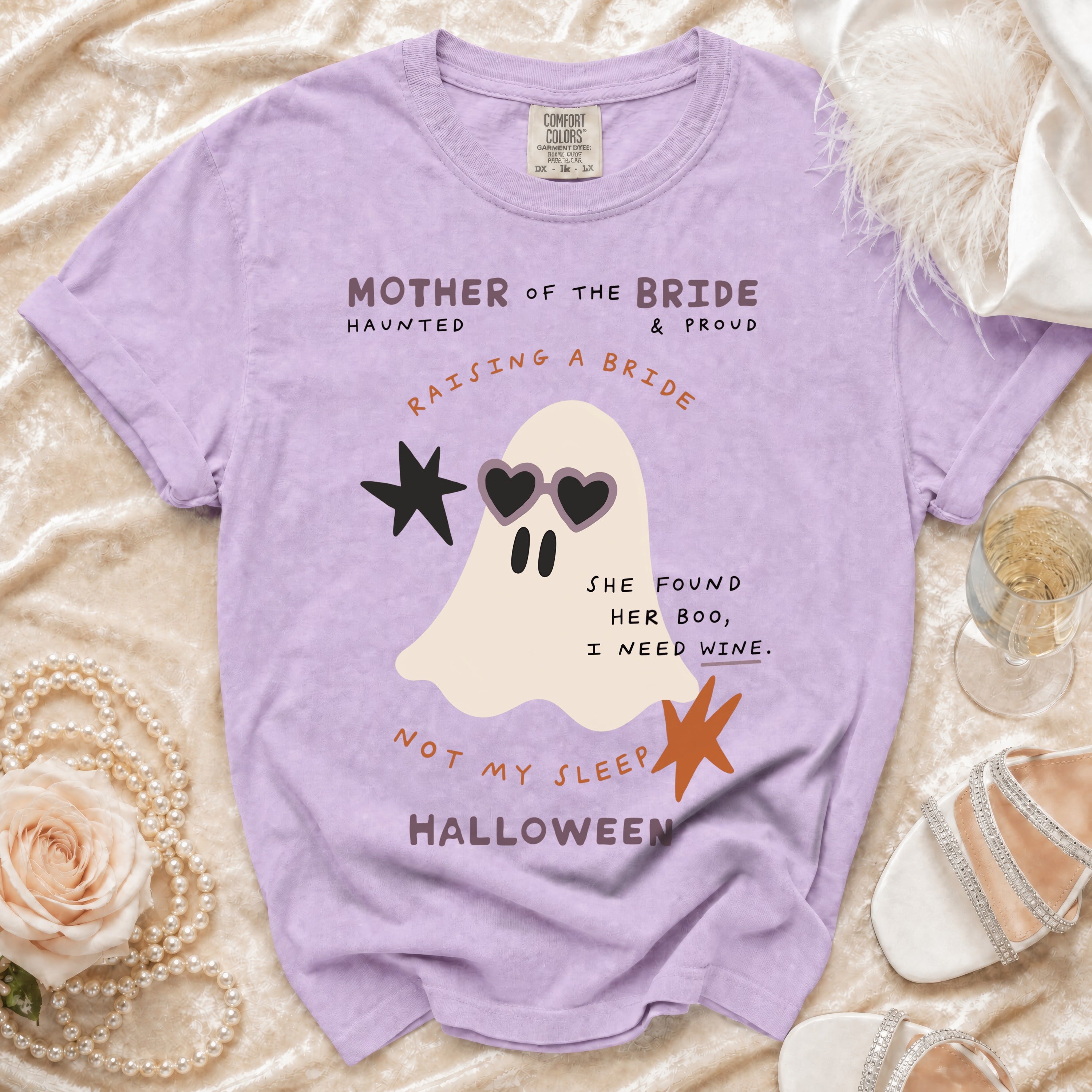 Purple t-shirt with ghost graphic and text "Mother of the Bride".