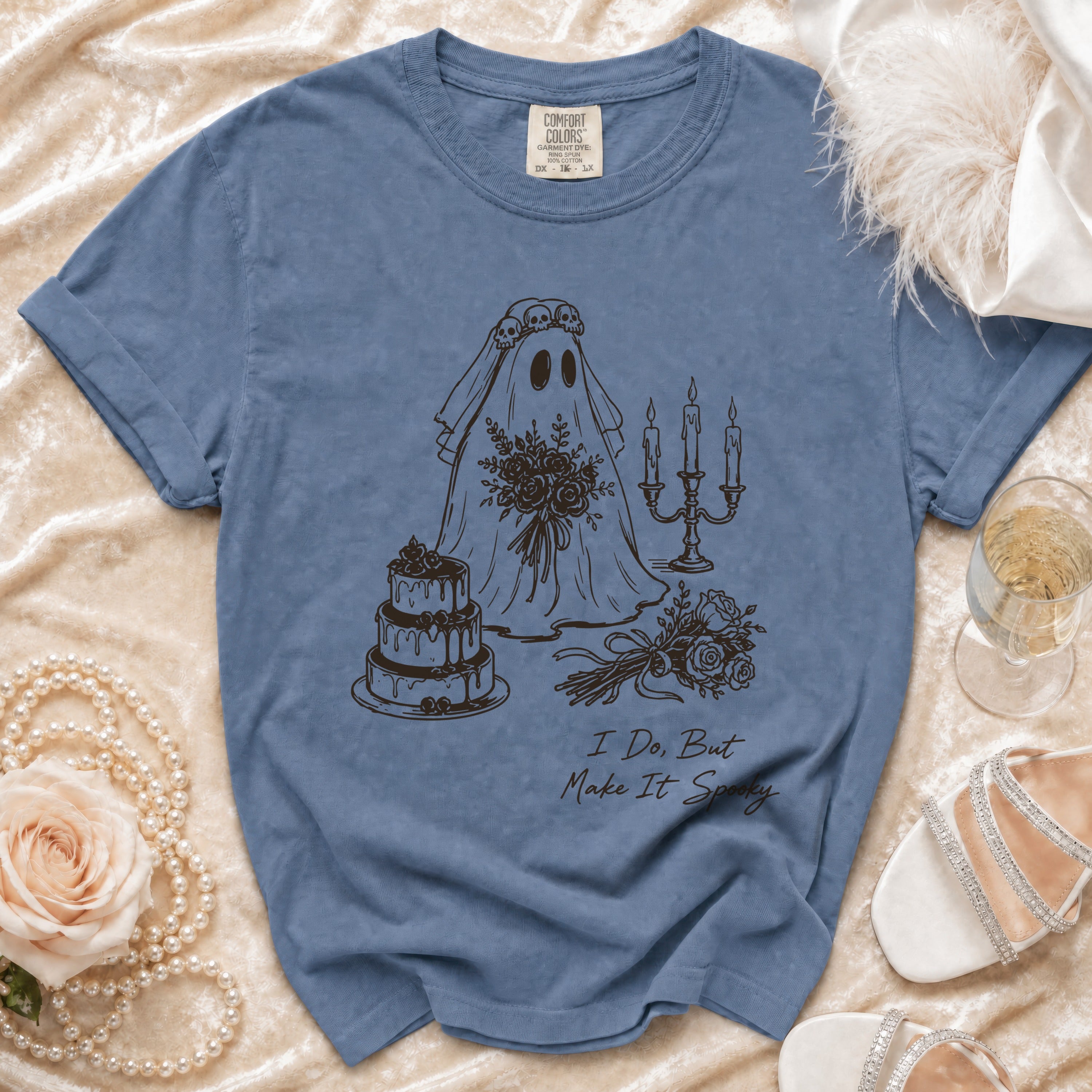 Blue t-shirt with ghost bride graphic, cake, and text "I Do, But Make It Spooky."