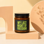 Brown candle with black label saying "Smells Like My Last Night Of Freedom".