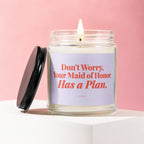 Jar candle with lit wick and lid next to it, displaying text "Don't Worry, Your Maid of Honor Has a Plan."