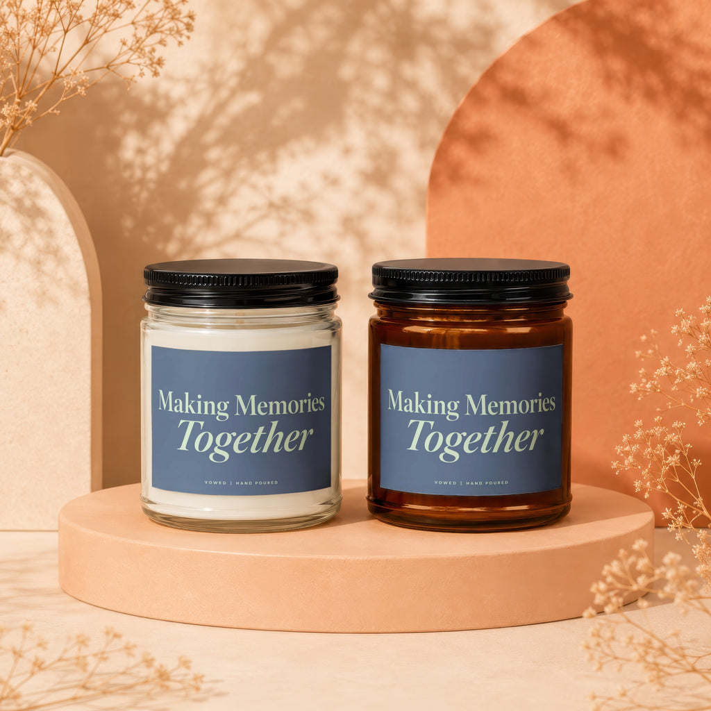 Two scented candles with "Making Memories Together" text and "vowed | hand poured" labels.