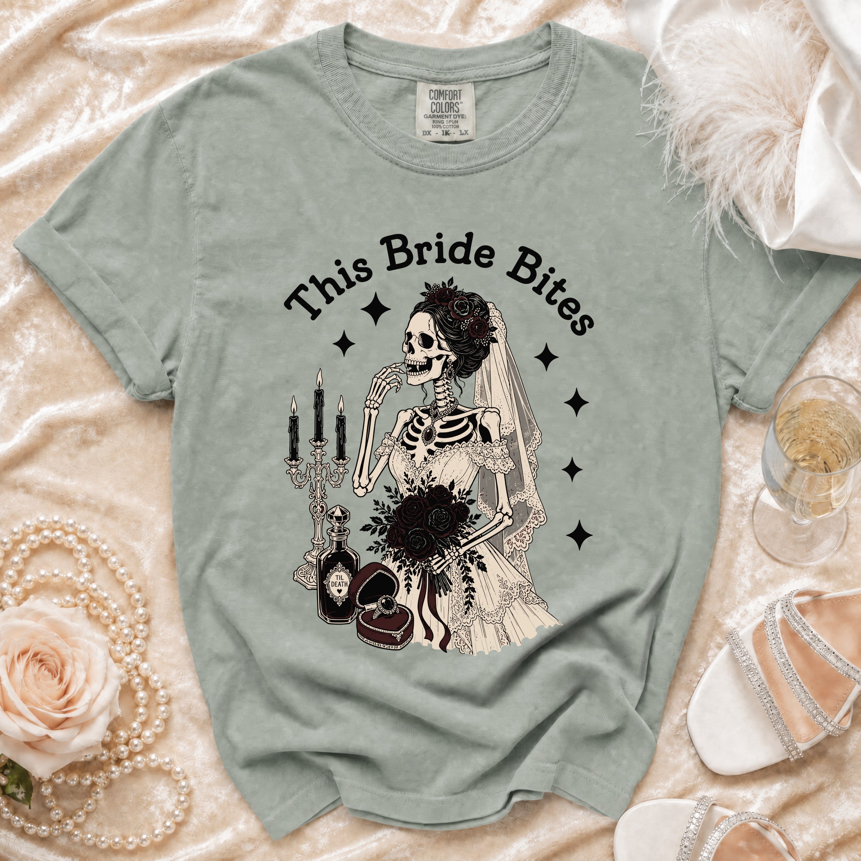 Green t-shirt with a skeleton bride graphic and the text "This Bride Bites".