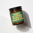 Amber jar candle with black lid, label reads "I CAN'T GET HITCHED WITHOUT MY FAVORITE B*TCH".