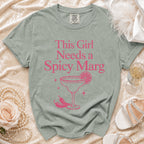 Green t-shirt with pink text "This Girl Needs a Spicy Marg" and margarita graphic.