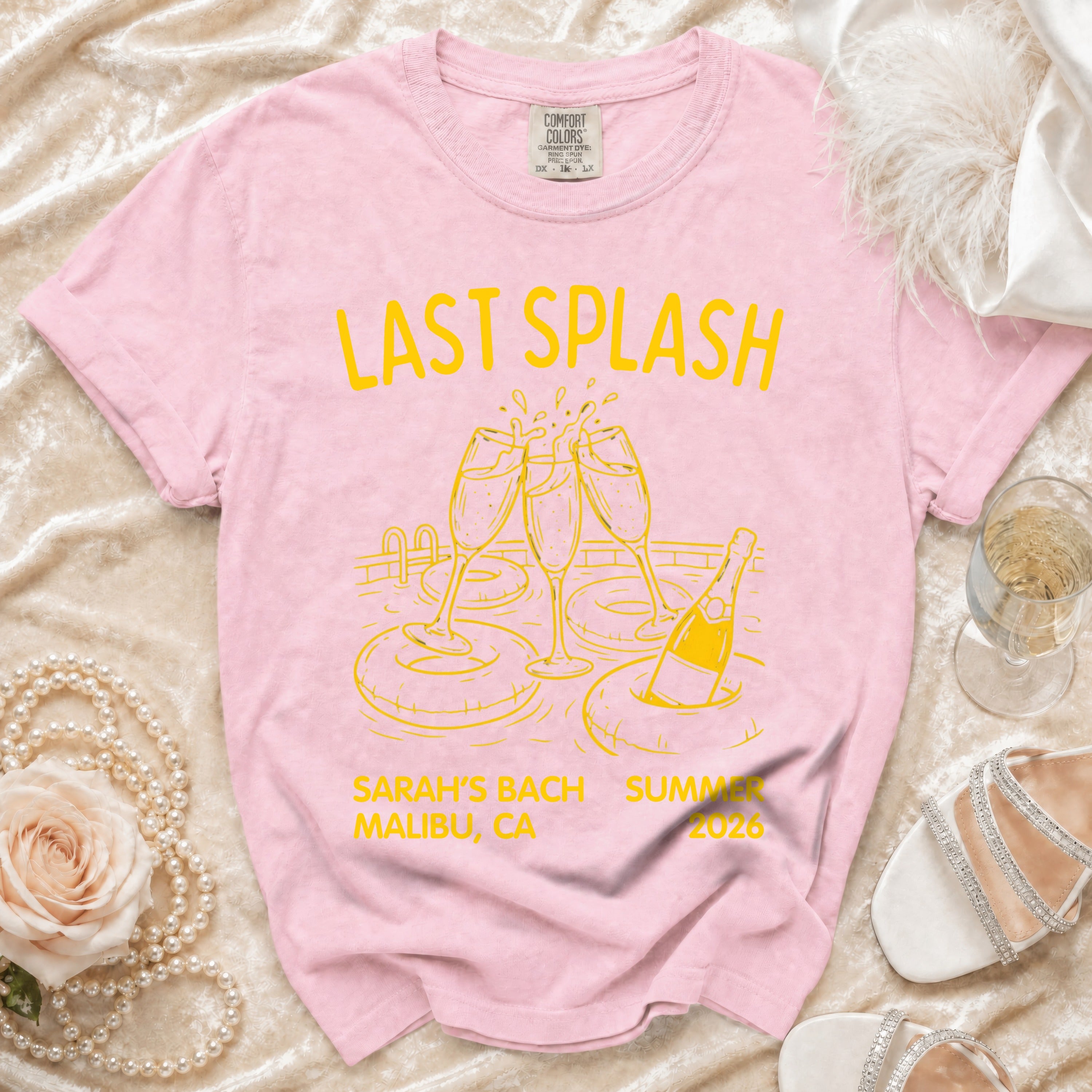Pink t-shirt with "Last Splash" text, Sarah's Bach, Malibu, CA 2026.