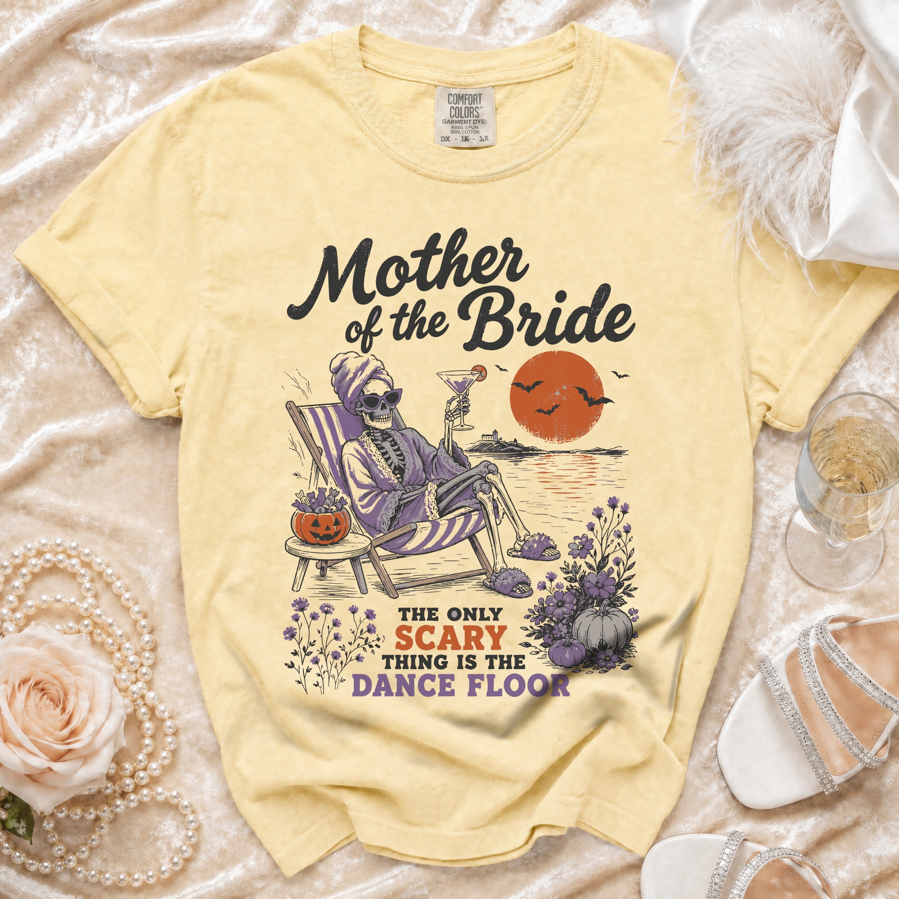Yellow t-shirt with "Mother of the Bride" and skeleton graphic.