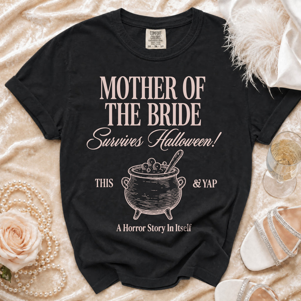 Black t-shirt with "Mother of the Bride Survives Halloween!" text and cauldron graphic.