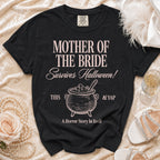 Black t-shirt with "Mother of the Bride Survives Halloween!" text and cauldron graphic.