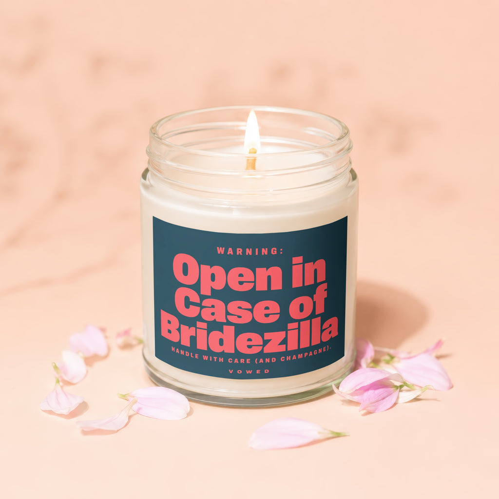Glass candle with lit wick, label reads "Open in Case of Bridezilla".