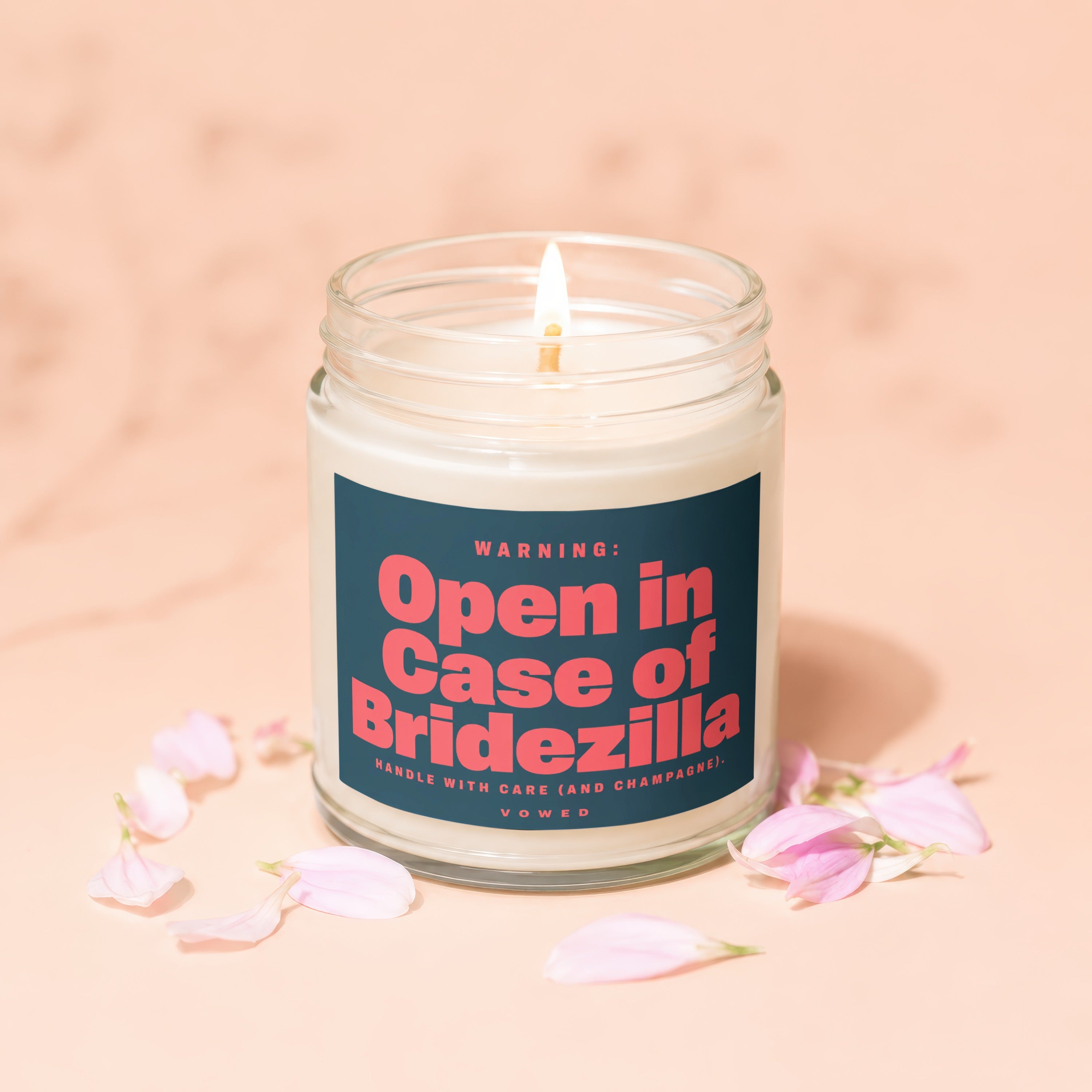 Glass candle with lit wick, label reads "Open in Case of Bridezilla".