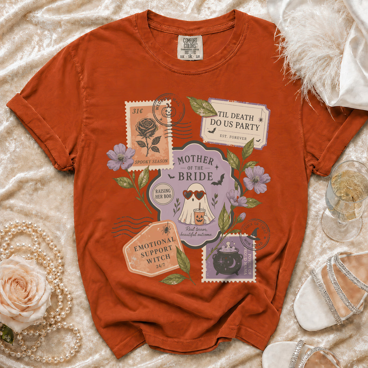 Orange t-shirt with "Mother of the Bride" Halloween-themed stamps and graphics.