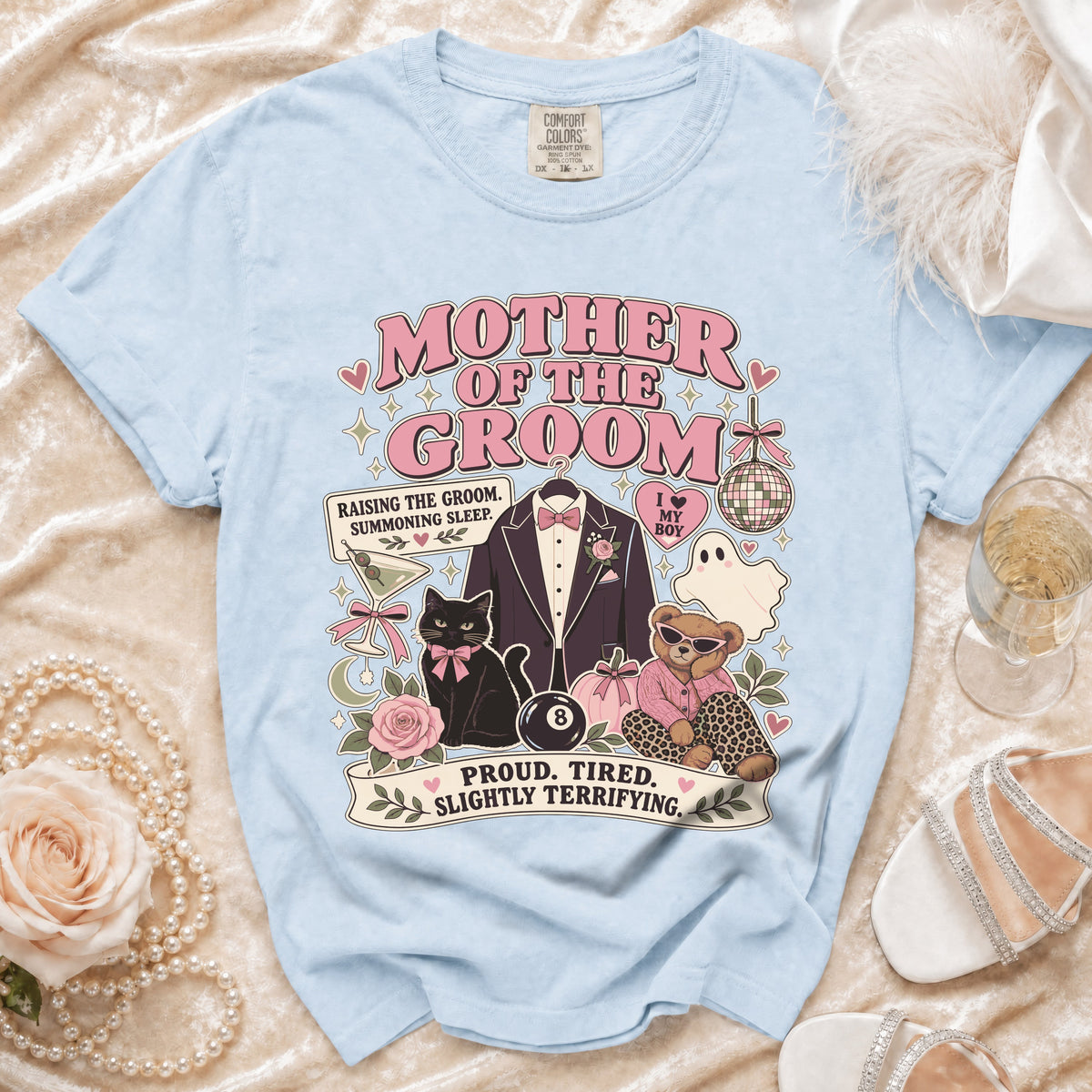 Light blue t-shirt with "Mother of the Groom" design, tuxedo, cat, bear, and text.