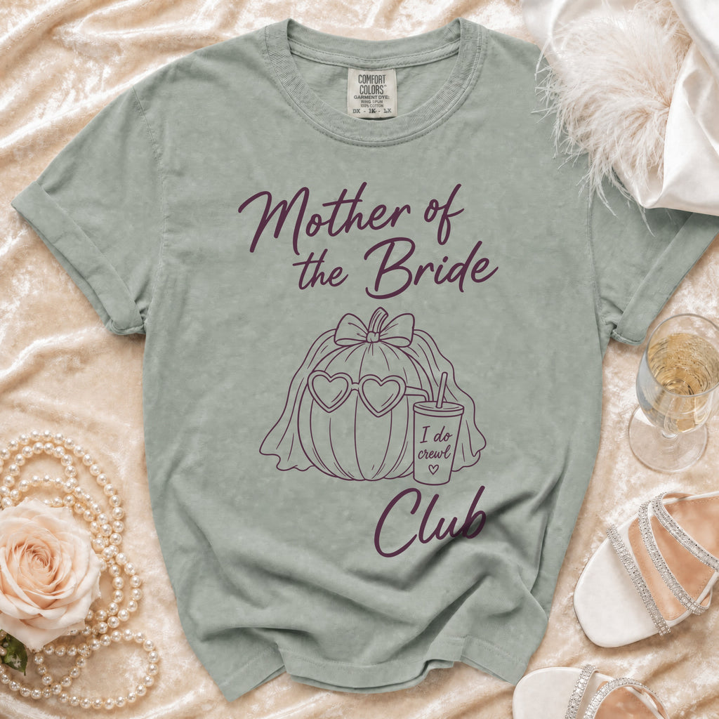 Light green t-shirt with "Mother of the Bride" and "Club" text and pumpkin graphic.