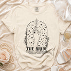 Cream t-shirt with "The Bride Corinne's Bachelorette" graphic.