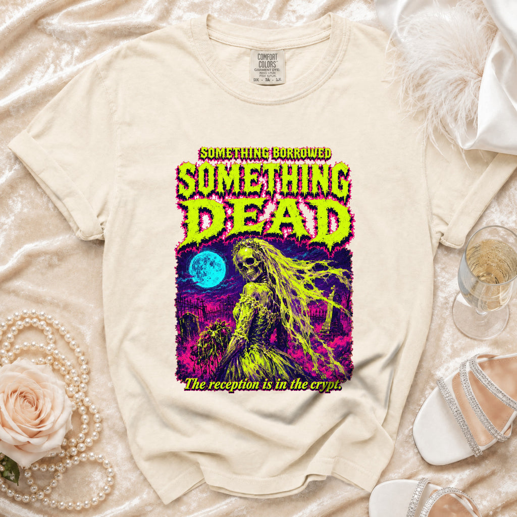 Cream t-shirt with "Something Borrowed Something Dead" graphic and crypt.
