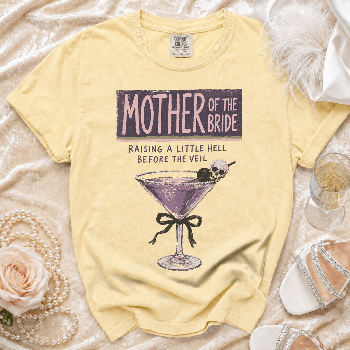 Yellow t-shirt with "Mother of the Bride" graphic and a cocktail.