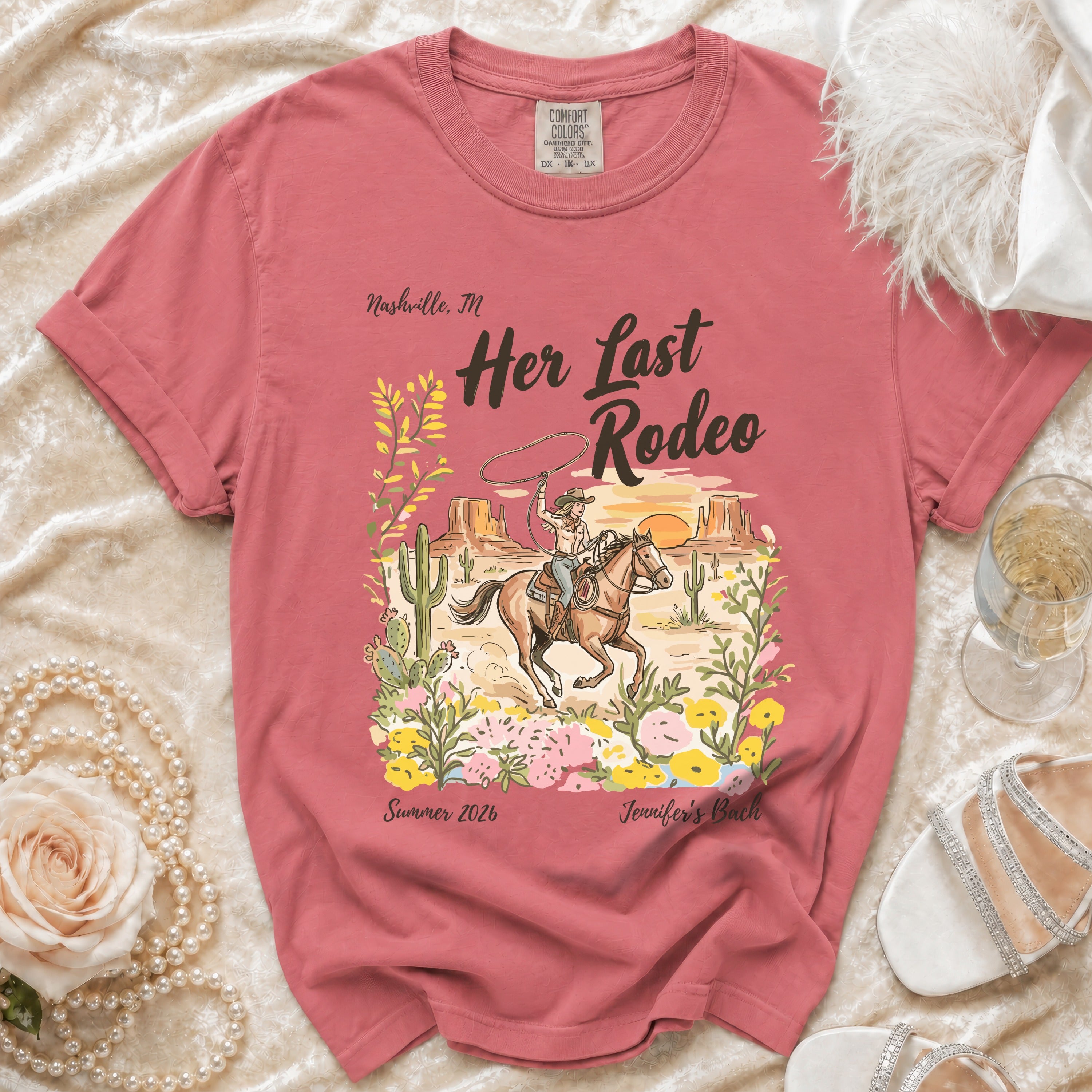 T-shirt with desert rodeo scene and "Her Last Rodeo" text.