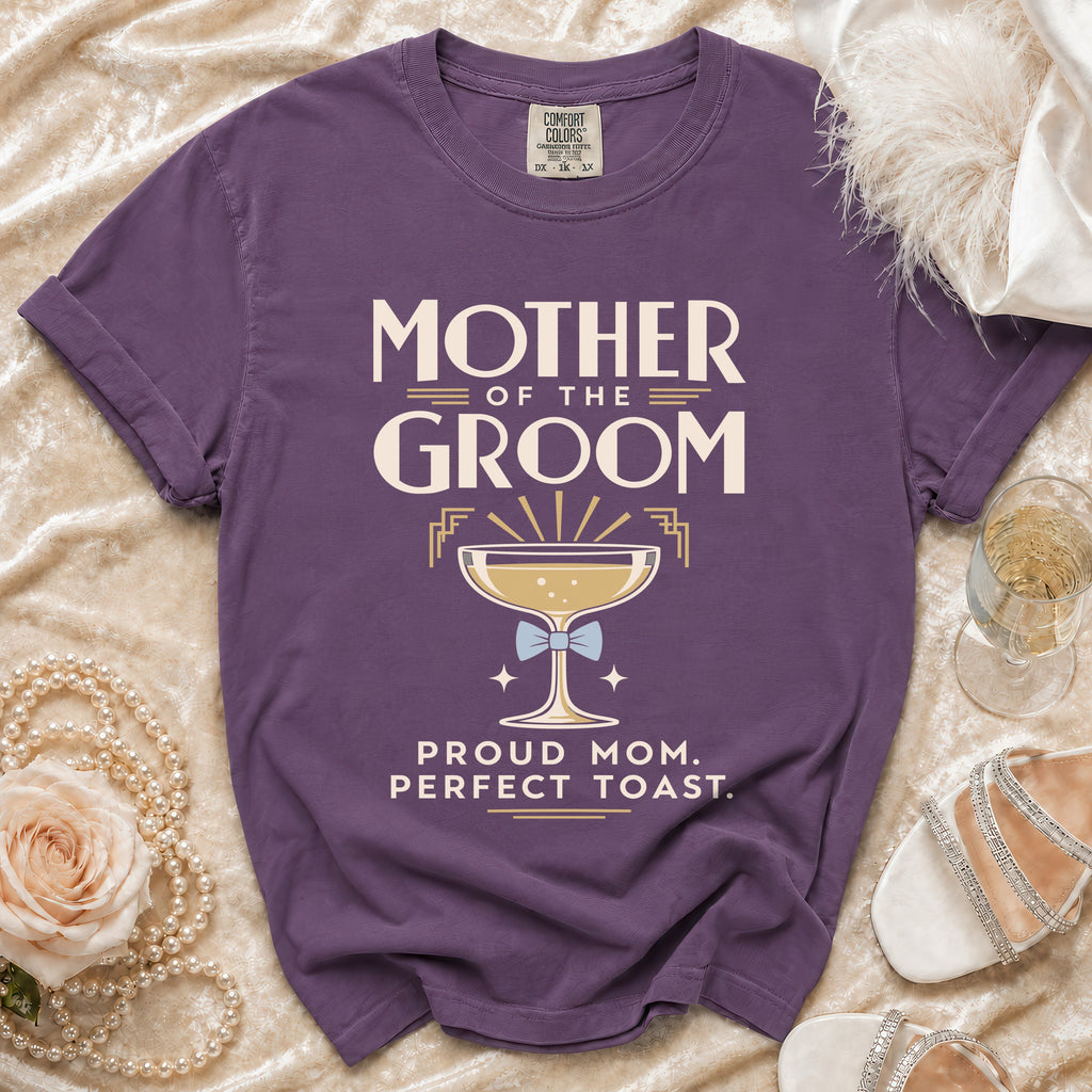Purple t-shirt with "Mother of the Groom" and champagne glass graphic.
