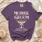 Purple t-shirt with "Mother of the Groom" and champagne glass graphic.