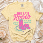 Yellow t-shirt with "Her Last Rodeo" in pink, cowgirl boots, hat, and rope.