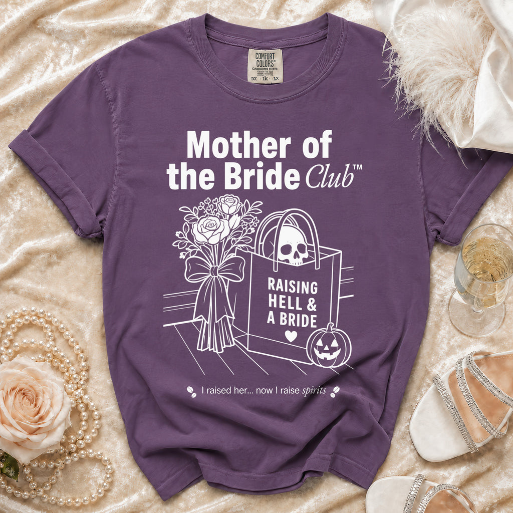 Purple t-shirt with "Mother of the Bride Club" and skull graphic.