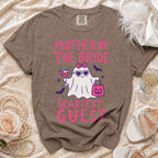Brown Comfort Colors t-shirt with pink "Mother of the Bride Scariest Guest" text and ghost graphic.